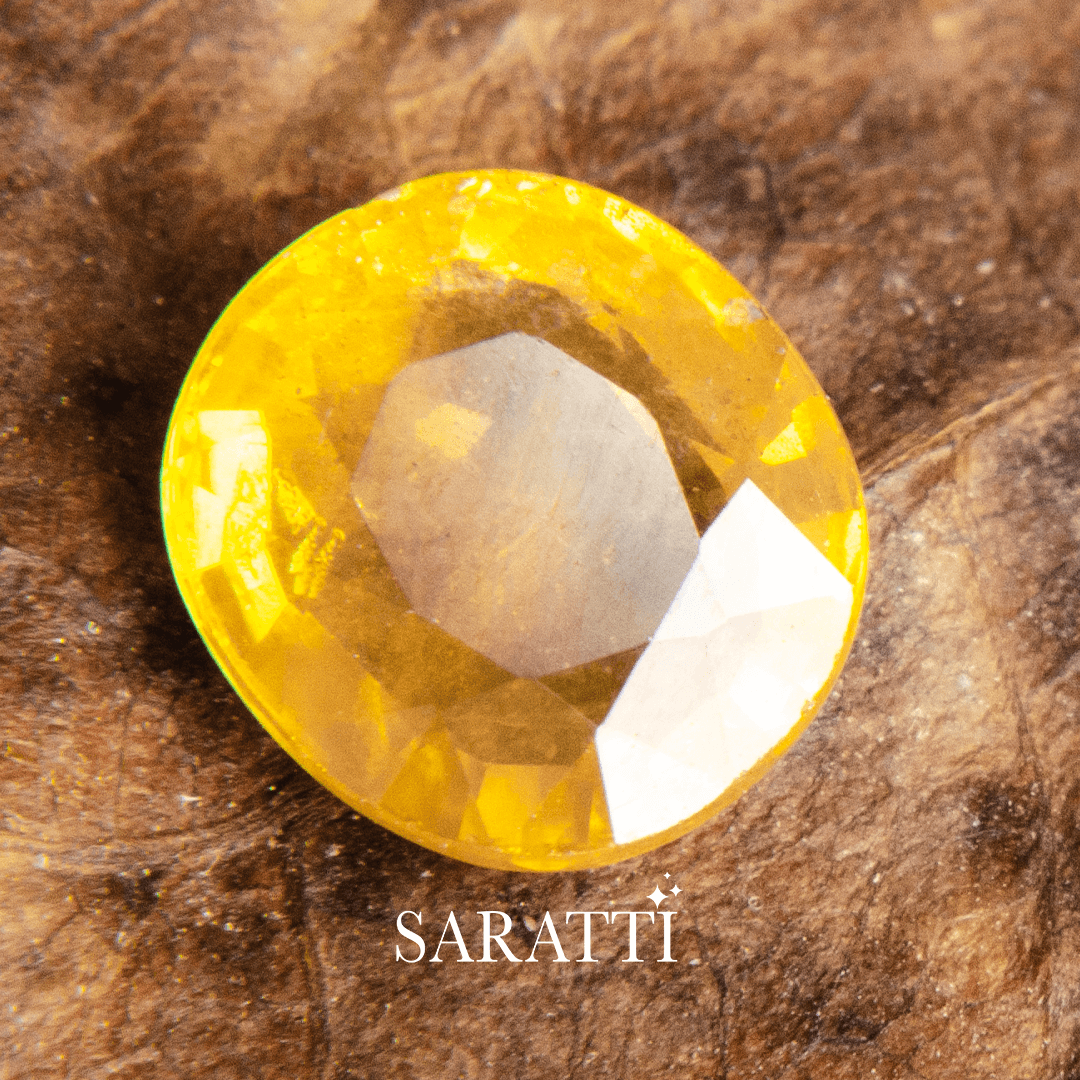 Oval Yellow Sapphire Gemstone weighing 1.46 carats | SARATTI | Yellow sapphire on Dark Background - www.saratti.com