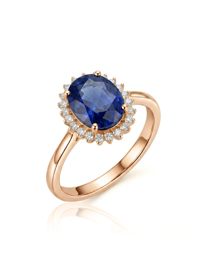 Oval blue sapphire promise ring with sunburst diamond halo in 18K rose gold | SARATTI