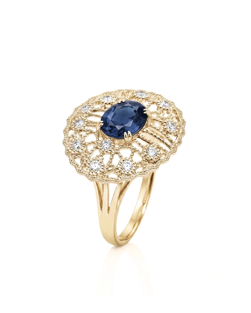 Oval blue sapphire ring with antique filigree diamond accents in 18K yellow gold | SARATTI