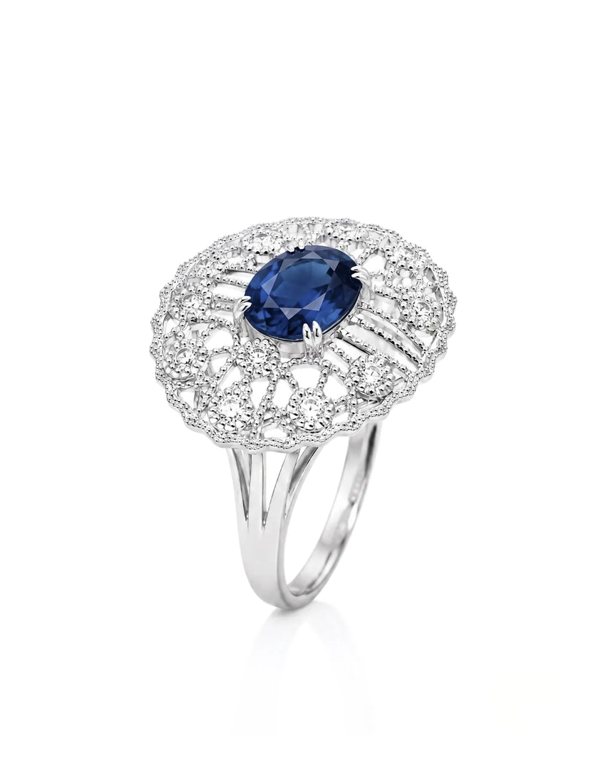 Oval blue sapphire ring with antique filigree diamond accents in platinum | SARATTI