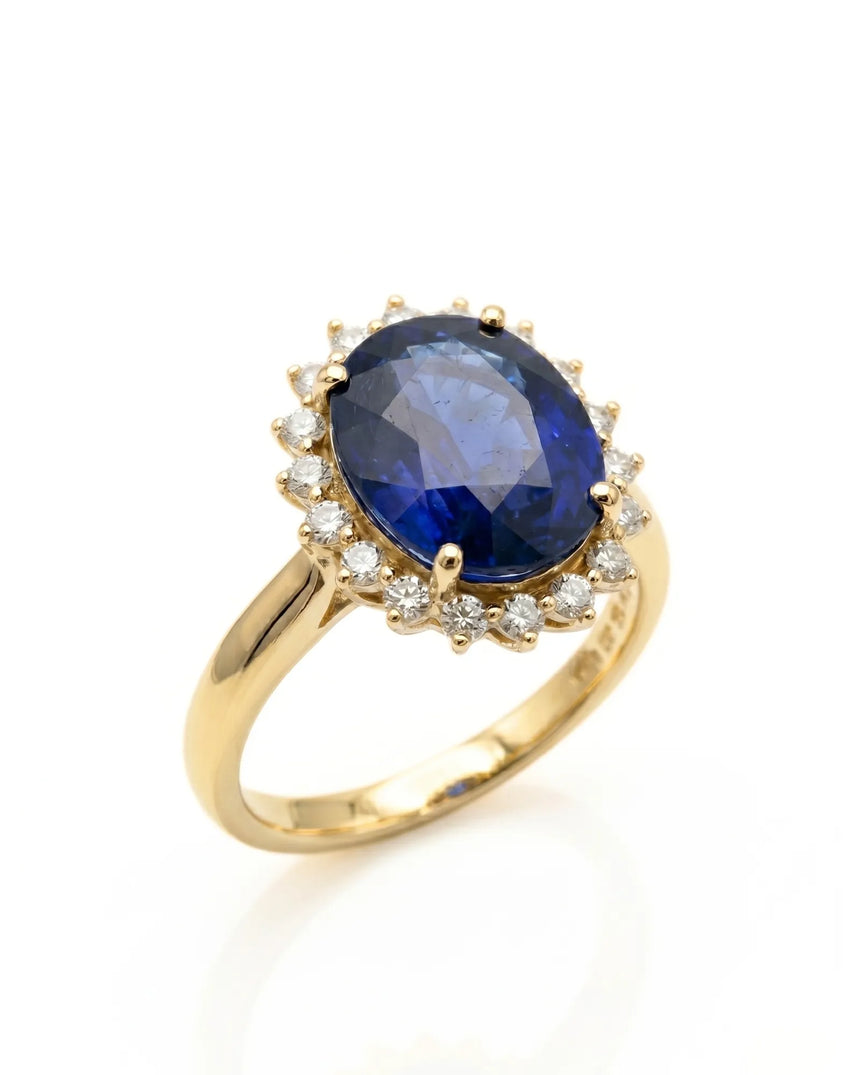 Oval blue sapphire ring with round diamond halo in 18K yellow gold | SARATTI