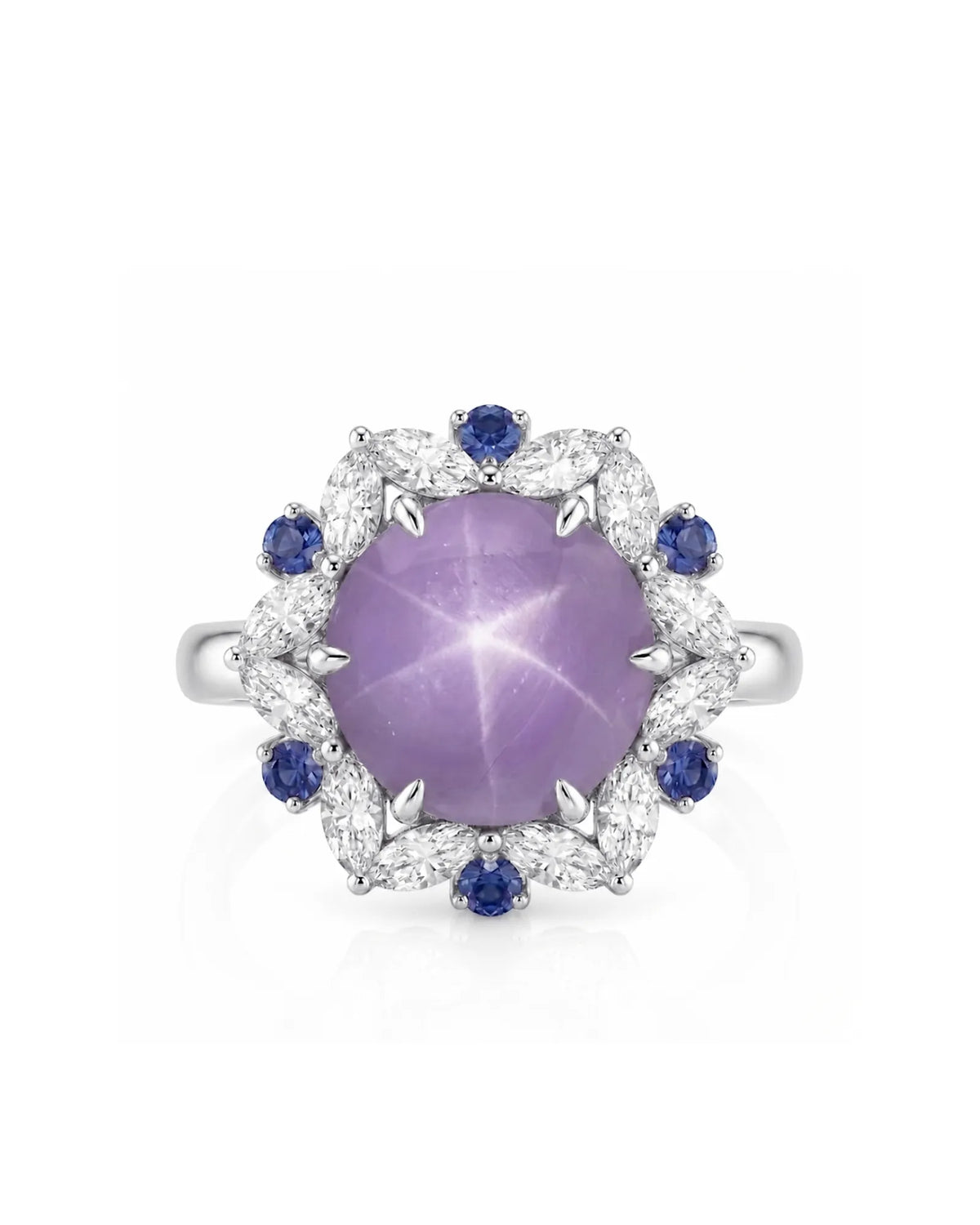 Oval cabochon natural star sapphire ring with blue sapphire accents in 18K white gold | SARATTI