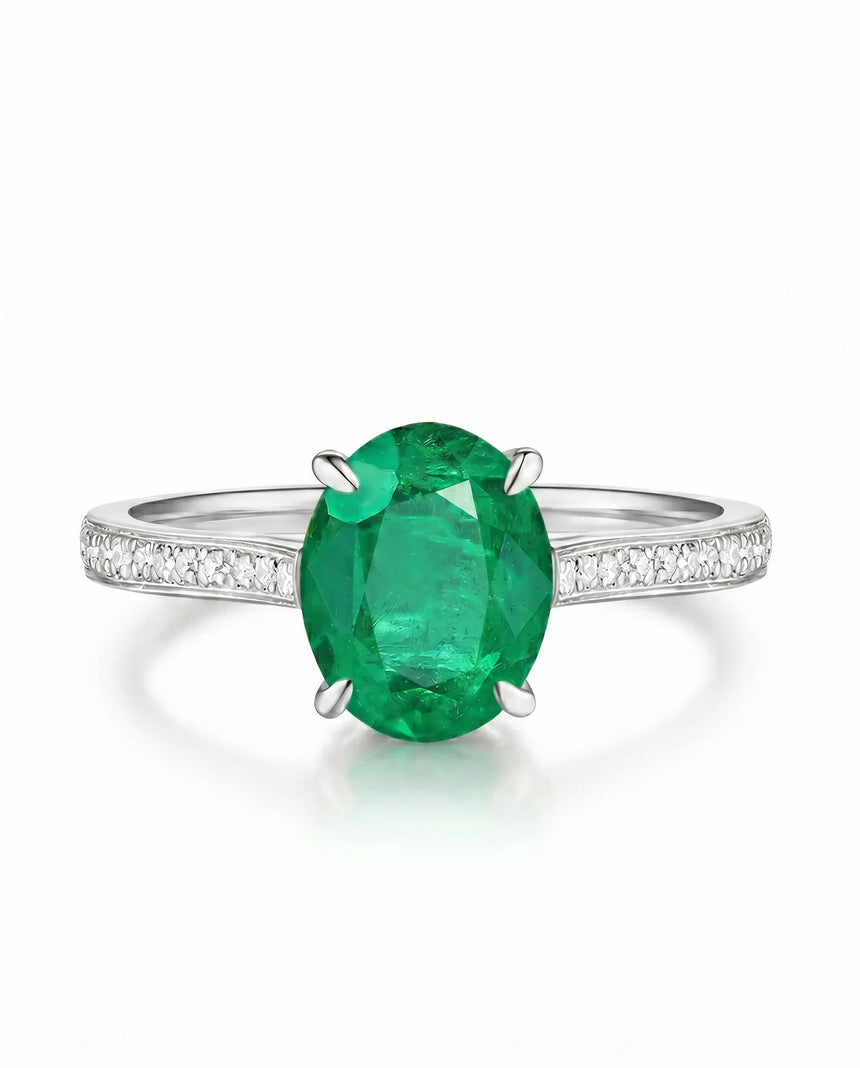 Oval emerald ring with diamond accents in platinum | SARATTI