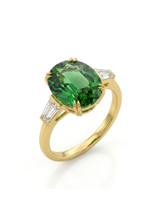 Oval green tourmaline ring with emerald-cut diamond side stones in 18K yellow gold | SARATTI