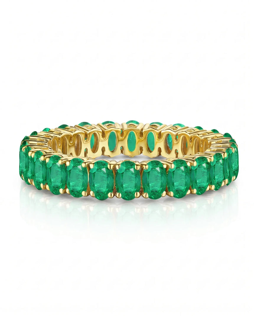 Oval natural emerald infinity band ring in 18K yellow gold | SARATTI