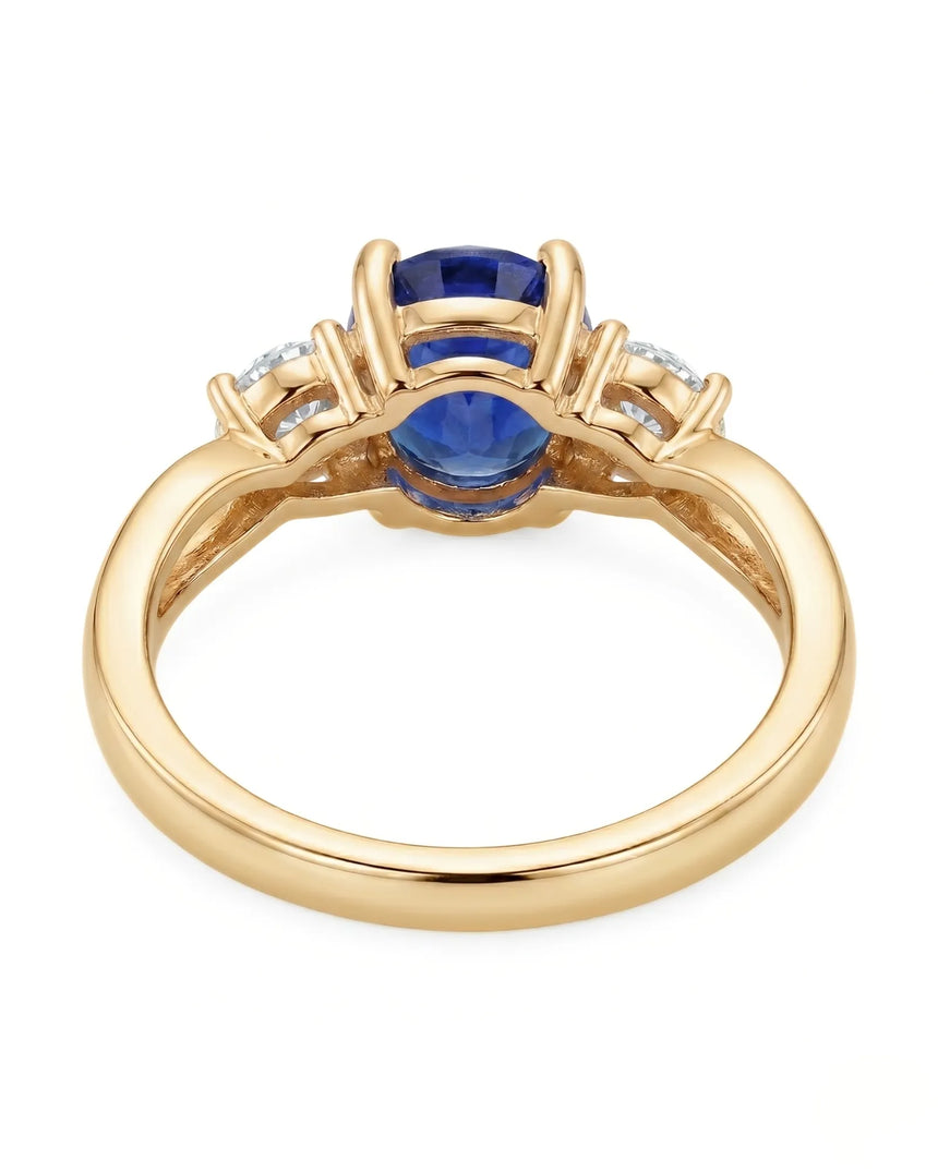 Oval natural sapphire ring with round side diamonds in 18K yellow gold | SARATTI