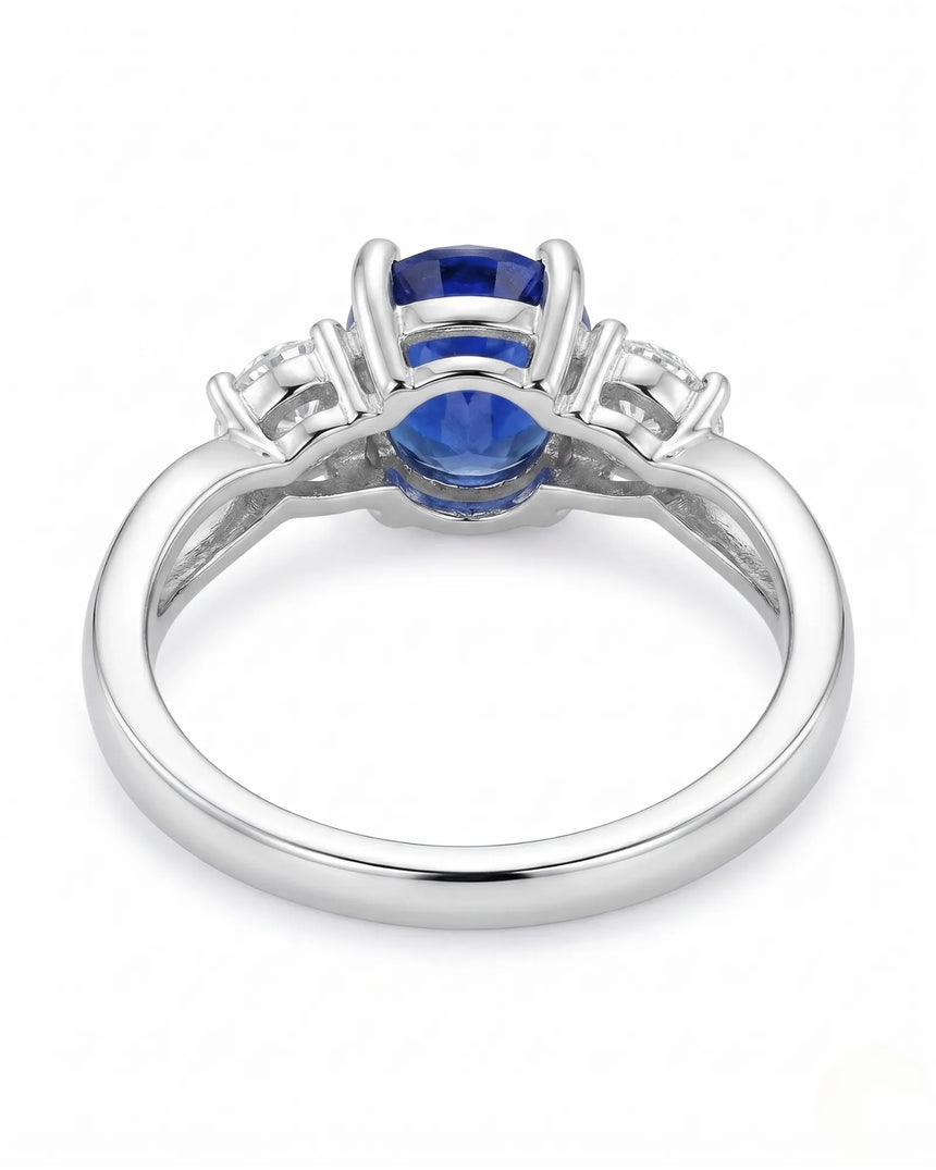Oval natural sapphire ring with round side diamonds in polished platinum - SARATTI