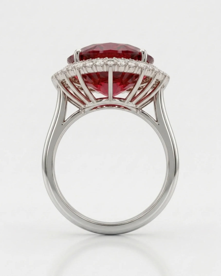 Oval red rubellite tourmaline ring with sparkling diamond accents in a platinum design | SARATTI