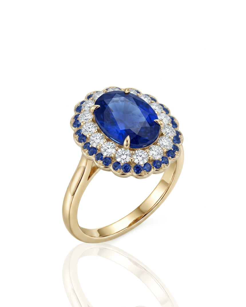 Oval royal blue sapphire double halo ring with diamond accents in 18K yellow gold | SARATTI