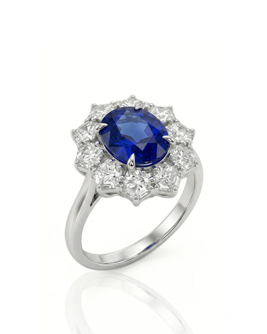 Oval royal blue sapphire ring with floral diamond halo in 18K white gold | SARATTI