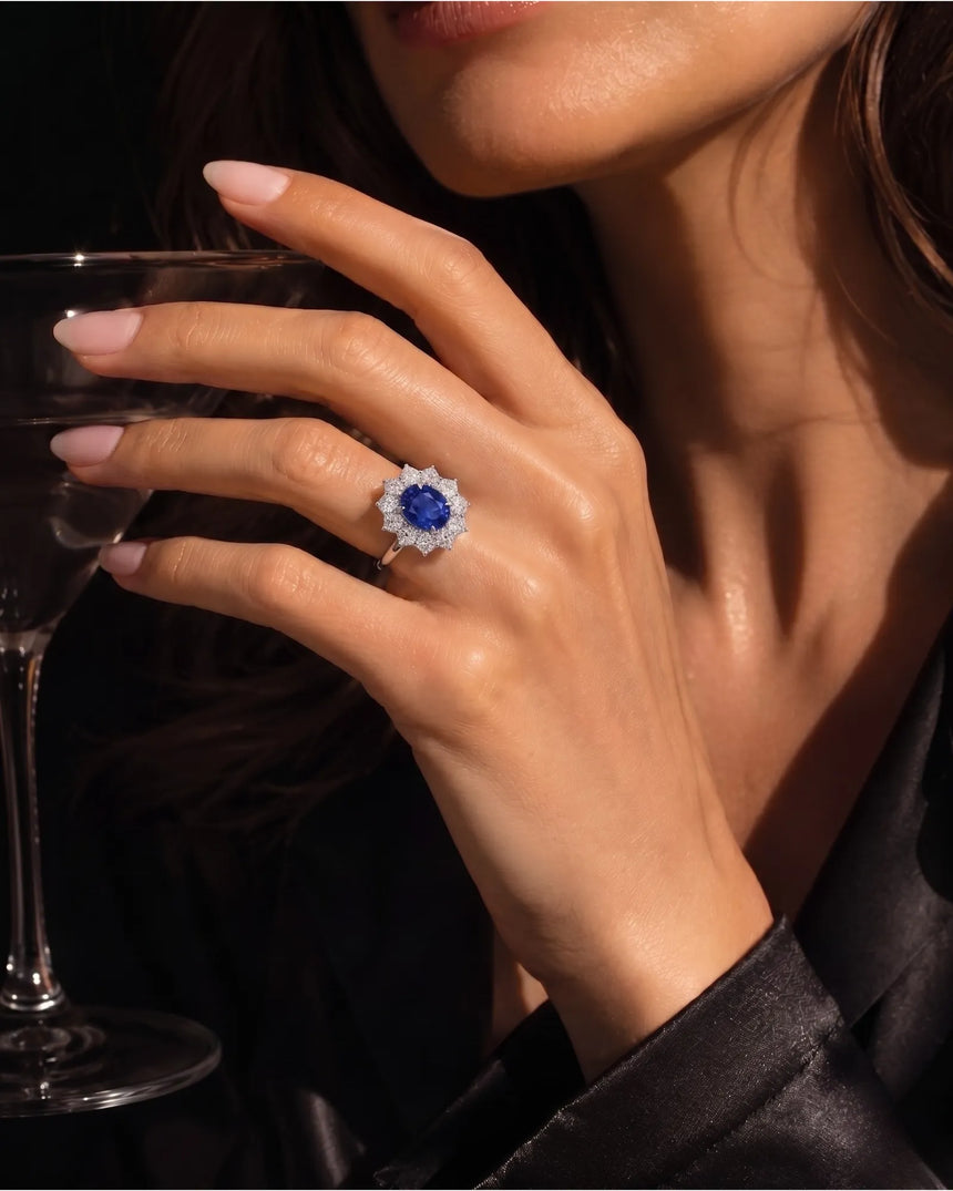 Oval royal blue sapphire ring with floral diamond halo in platinum - SARATTI