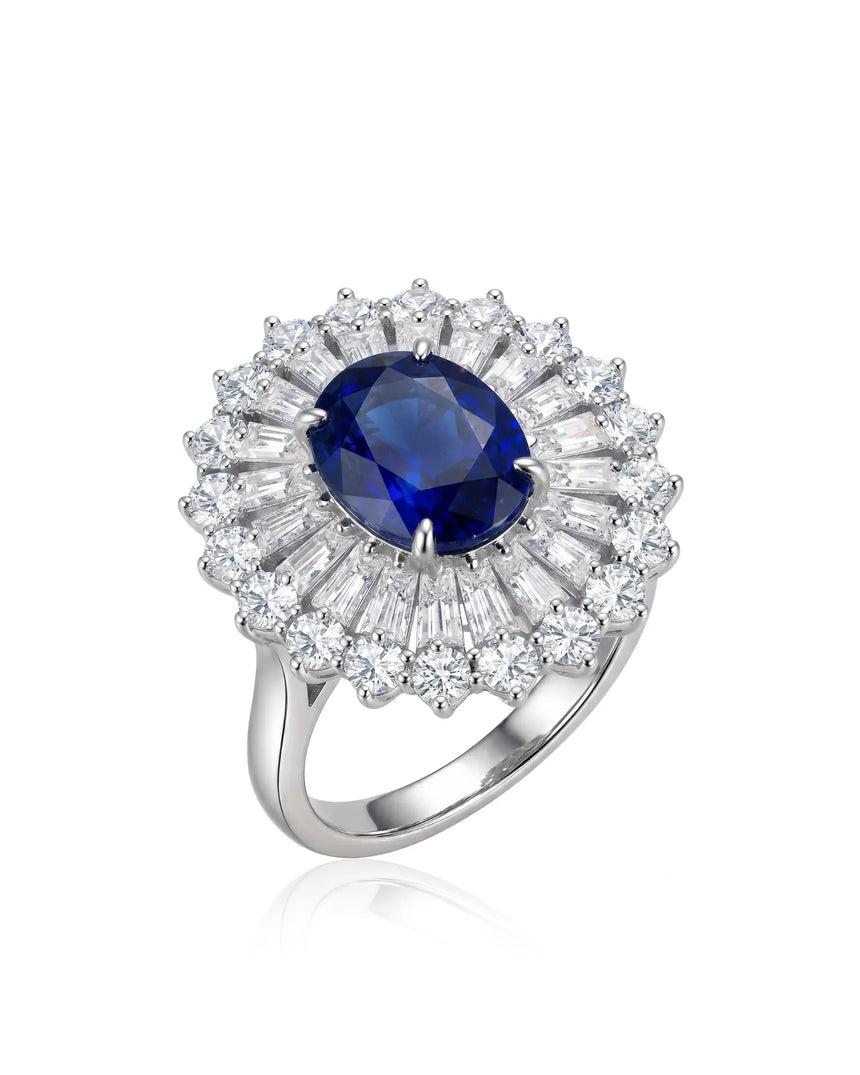 Oval royal blue sapphire ring with sunburst diamond halo in platinum | SARATTI