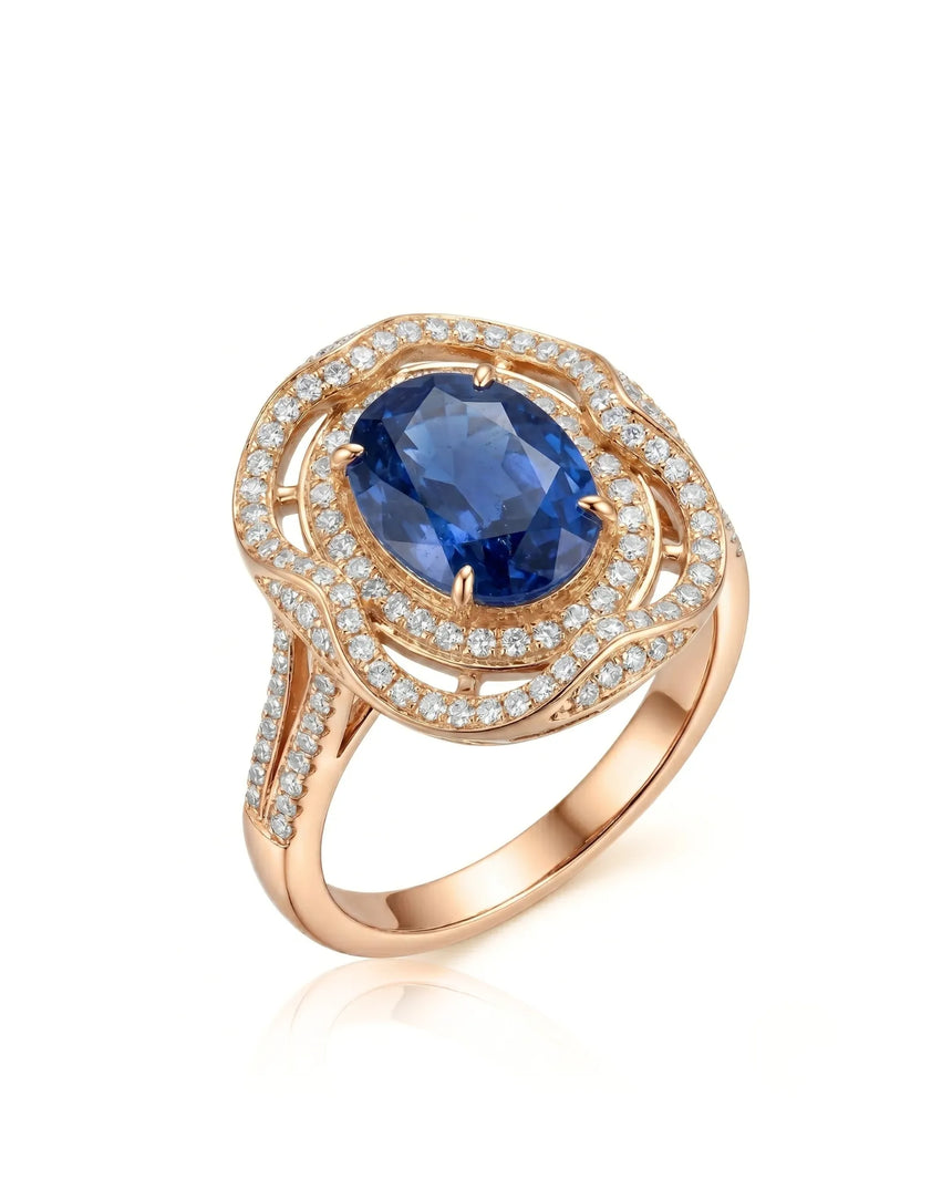 Oval royal blue sapphire ring with triple diamond halo in 18K rose gold | SARATTI