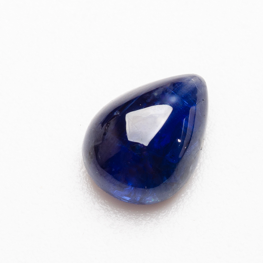 Pear cabochon sapphire photographed on white background | SARATTI