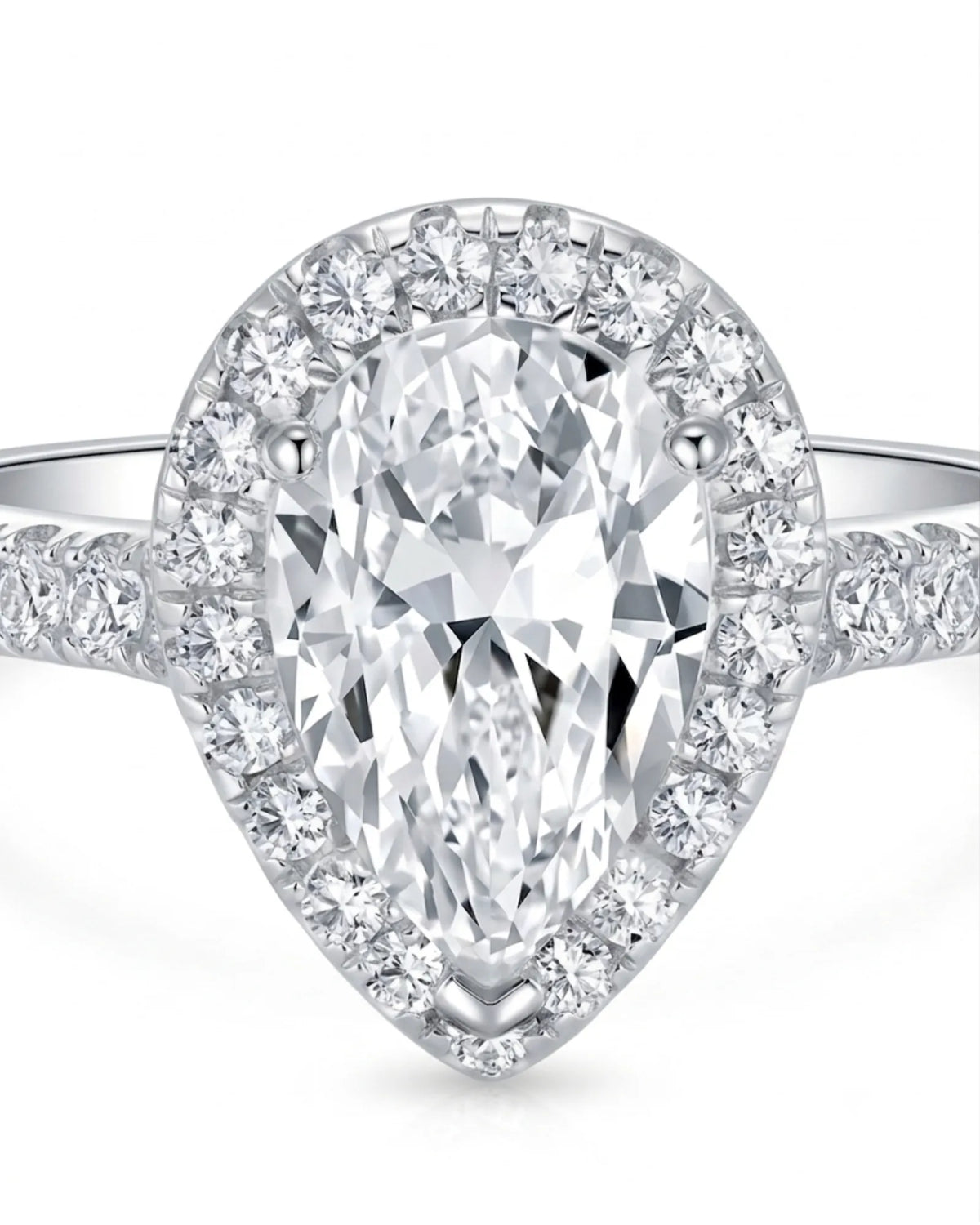 Pear halo moissanite engagement ring designed for an elegant proposal in enduring platinum | SARATTI
