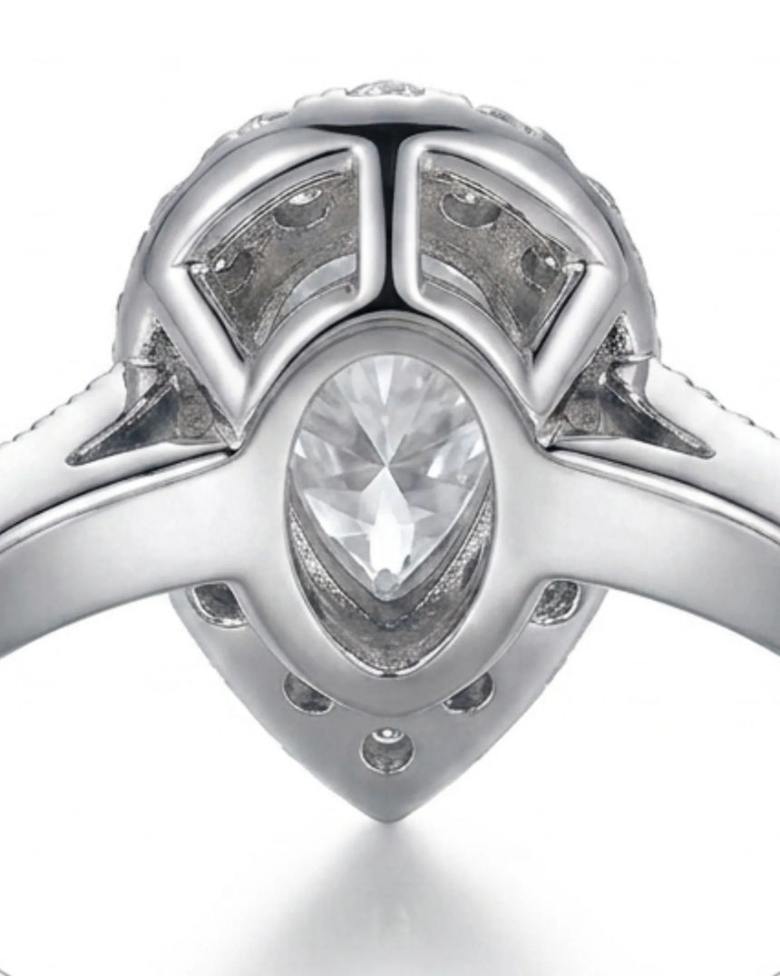 Pear halo moissanite engagement ring for a refined proposal crafted in platinum | SARATTI