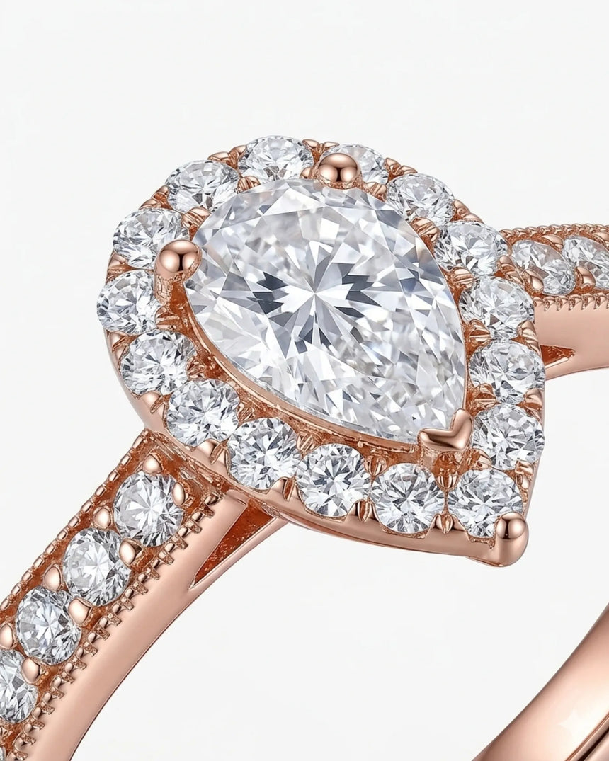 Pear halo moissanite engagement ring for a soft romantic proposal in rose gold | SARATTI