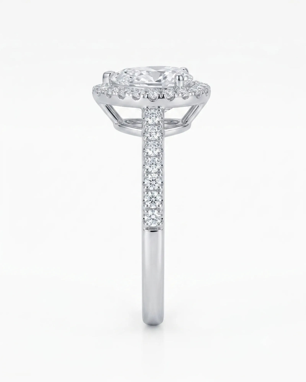 Pear halo moissanite engagement ring with pavé band for a romantic proposal in 18K white gold | SARATTI