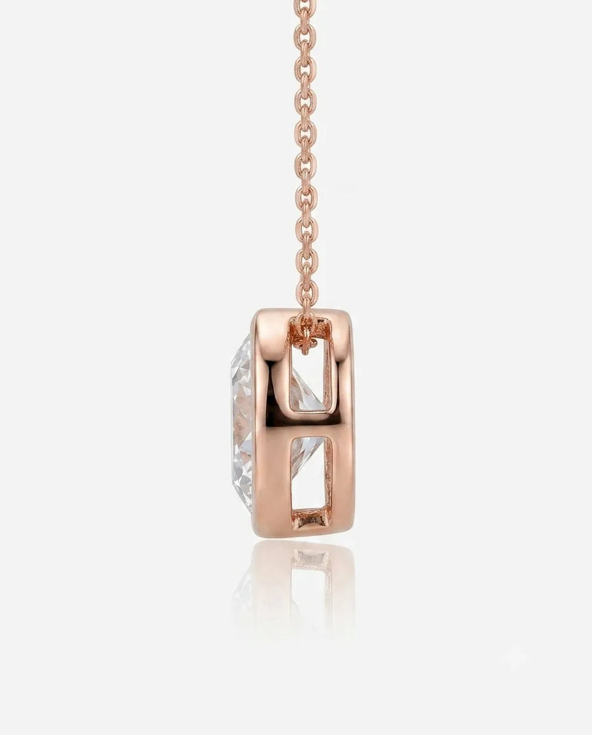 Petite bezel round diamond solitaire necklace in 18K Rose Gold, front view | SARATTI