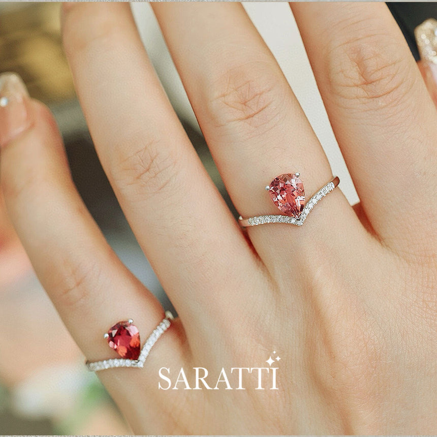 Model wears two of White Gold Teardrop Tiara Pink Tourmaline Engagement Rings | Saratti Fine Jewelry