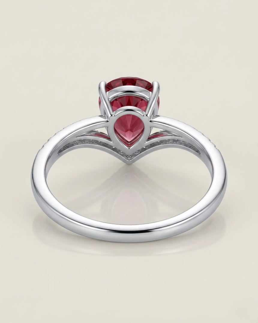 Pink pear tourmaline ring with curved diamond V shank in platinum | SARATTI