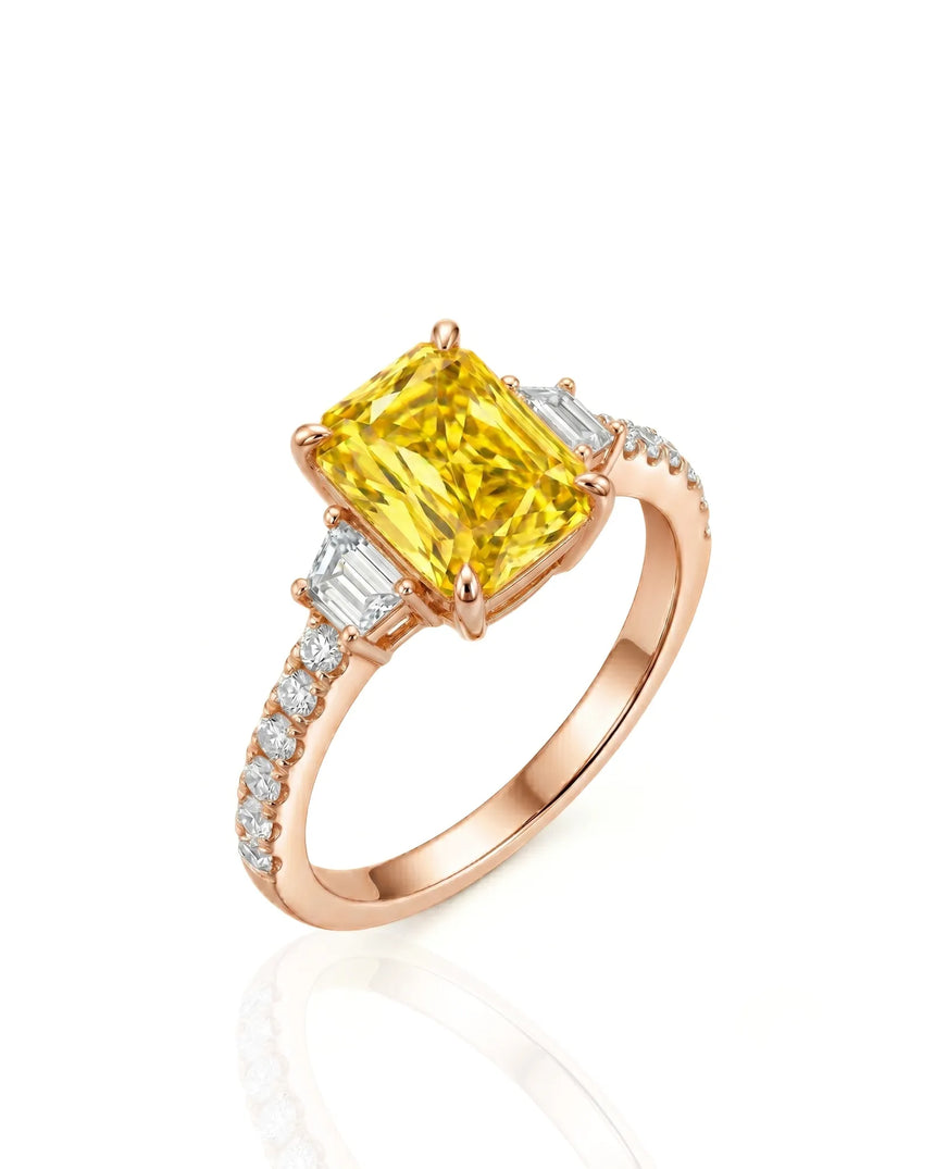 Radiant yellow sapphire ring with round and trapezoid diamonds in 18K rose gold | SARATTI