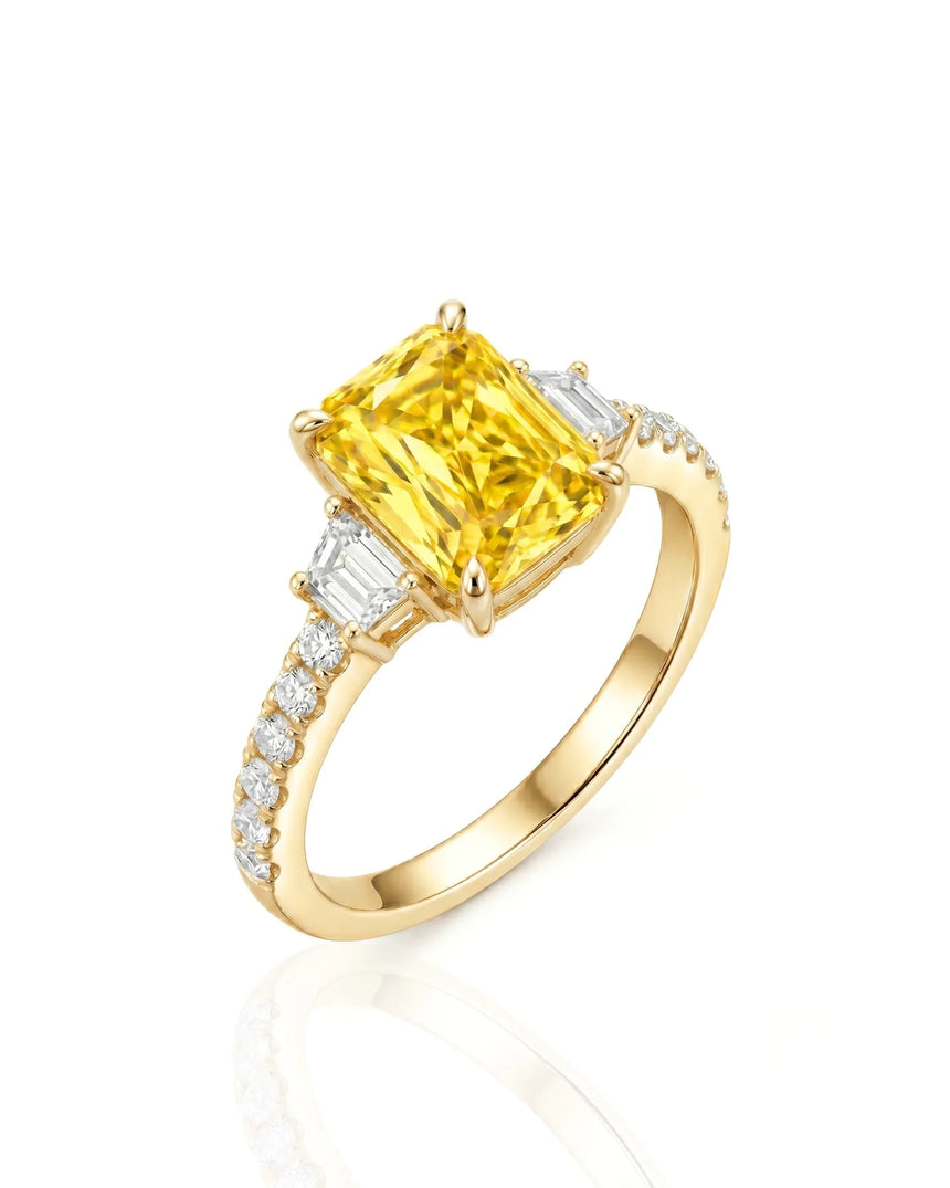 Radiant yellow sapphire ring with round and trapezoid diamonds in 18K yellow gold | SARATTI