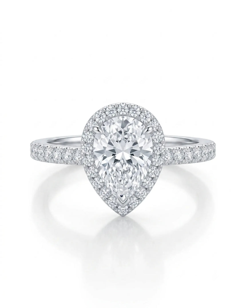 Refined teardrop moissanite ring with elevated halo setting and slender platinum band | SARATTI