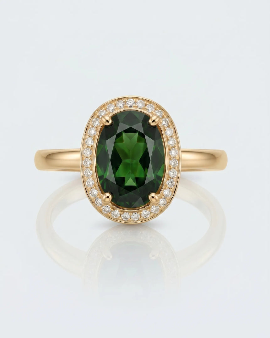 Rich forest green oval tourmaline ring framed by natural diamonds in 18K yellow gold | SARATTI