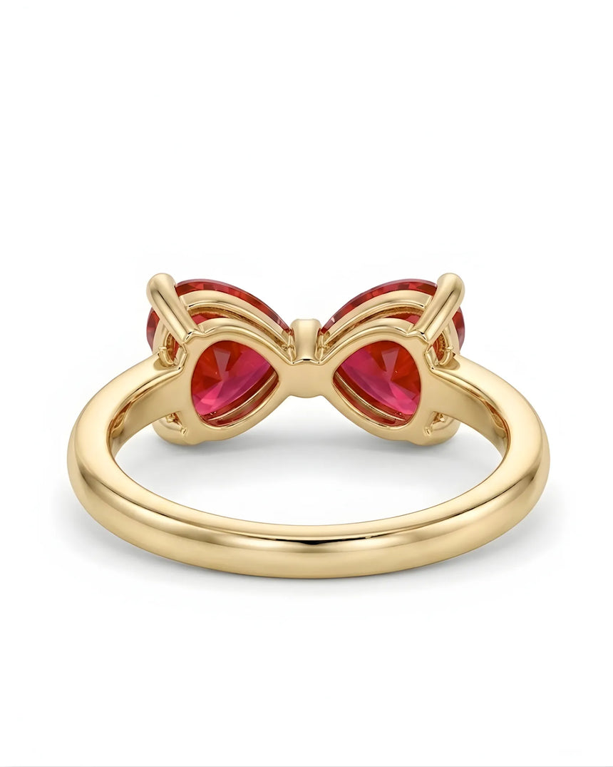Romantic bow style ruby ring with twin heart gemstones in 18K Yellow Gold | SARATTI