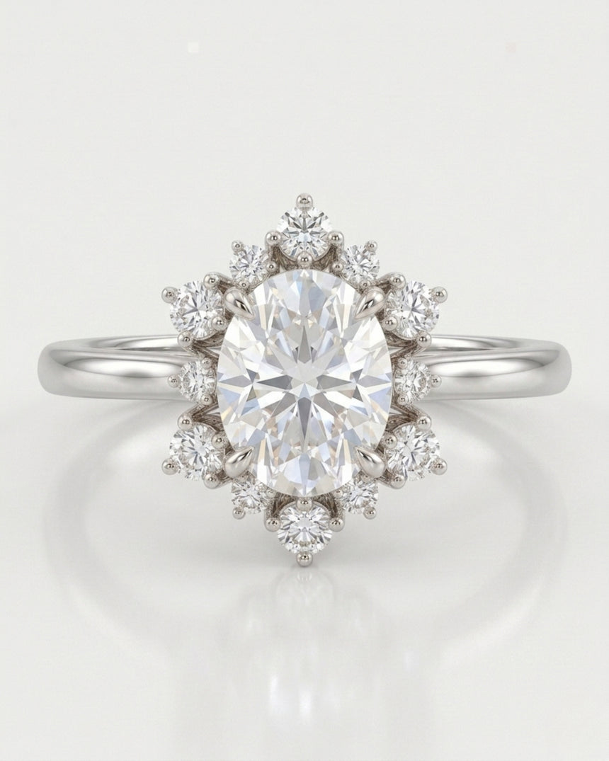 Romantic floral moissanite ring with oval center and crown-like halo in polished platinum | SARATTI