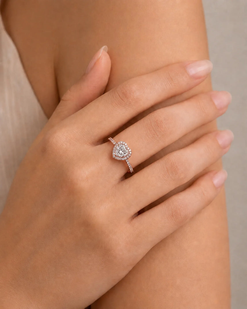 Romantic heart-shaped moissanite proposal ring with pavé halo and 18K rose gold band | SARATTI