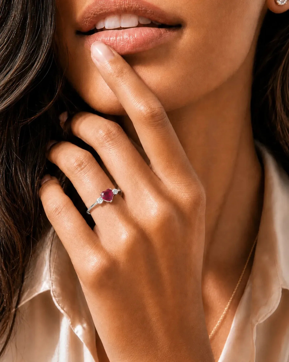 Romantic heart-shaped ruby ring with two diamond side stones in 18K White Gold | SARATTI