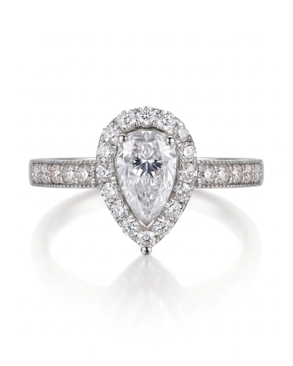Romantic pear shaped moissanite ring with teardrop halo and pavé shoulders in white gold | SARATTI