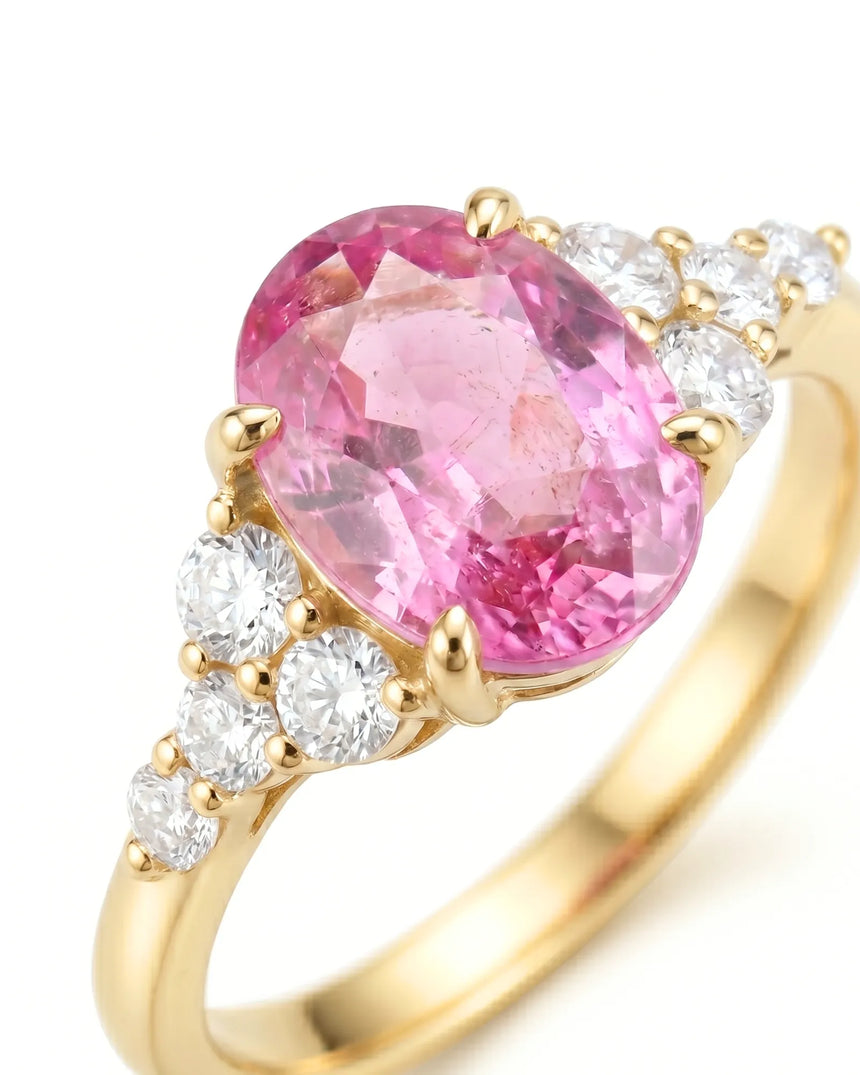 Romantic pink sapphire ring with delicate diamond shoulders in 18K yellow gold | SARATTI