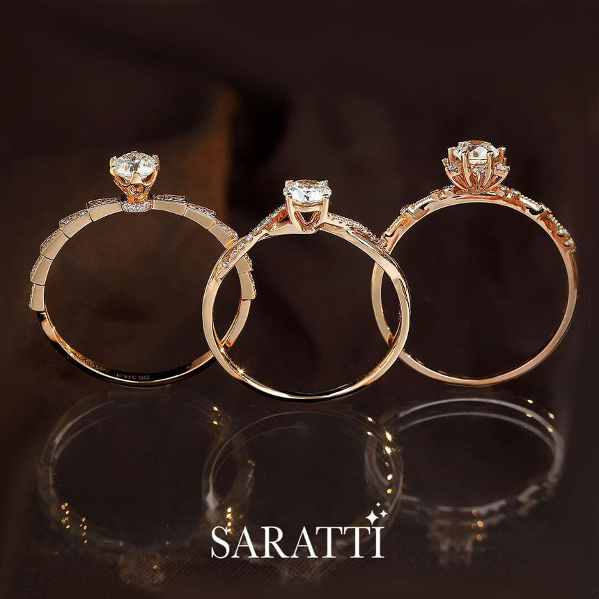 Upright angle of the Liaison Céleste Natural Diamond Engagement Ring in the middle of two other rings | Saratti Diamonds