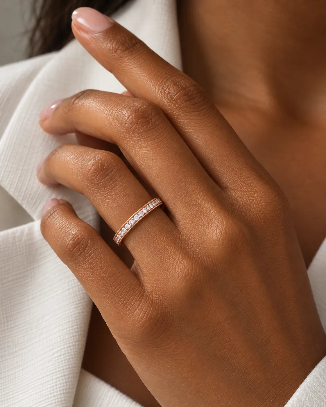 Milgrain diamond wedding band in 18K rose gold worn on hand | SARATTI
