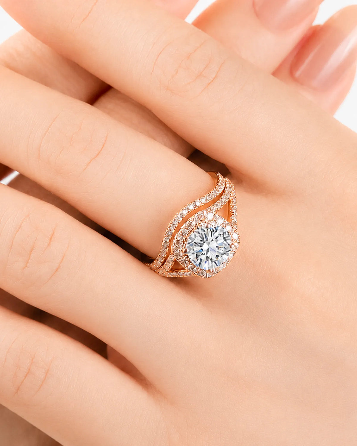 Round moissanite bridal set in rose gold with halo engagement ring and matching curved wedding band | SARATTI