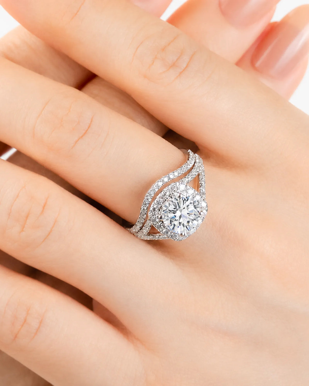Round moissanite bridal set in white gold with halo engagement ring and matching curved wedding band | SARATTI