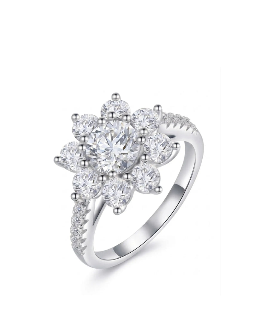 Round moissanite engagement ring with floral cluster halo and pavé shoulders in polished platinum | SARATTI