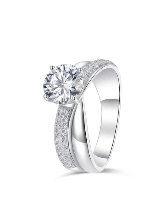 Round moissanite engagement ring with twisted split shank and pavé accents in 18K white gold | SARATTI