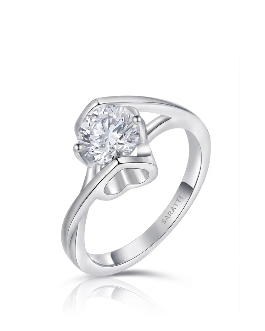 Round moissanite solitaire engagement ring with Möbius band and heart basket in 18K white gold | SARATTI