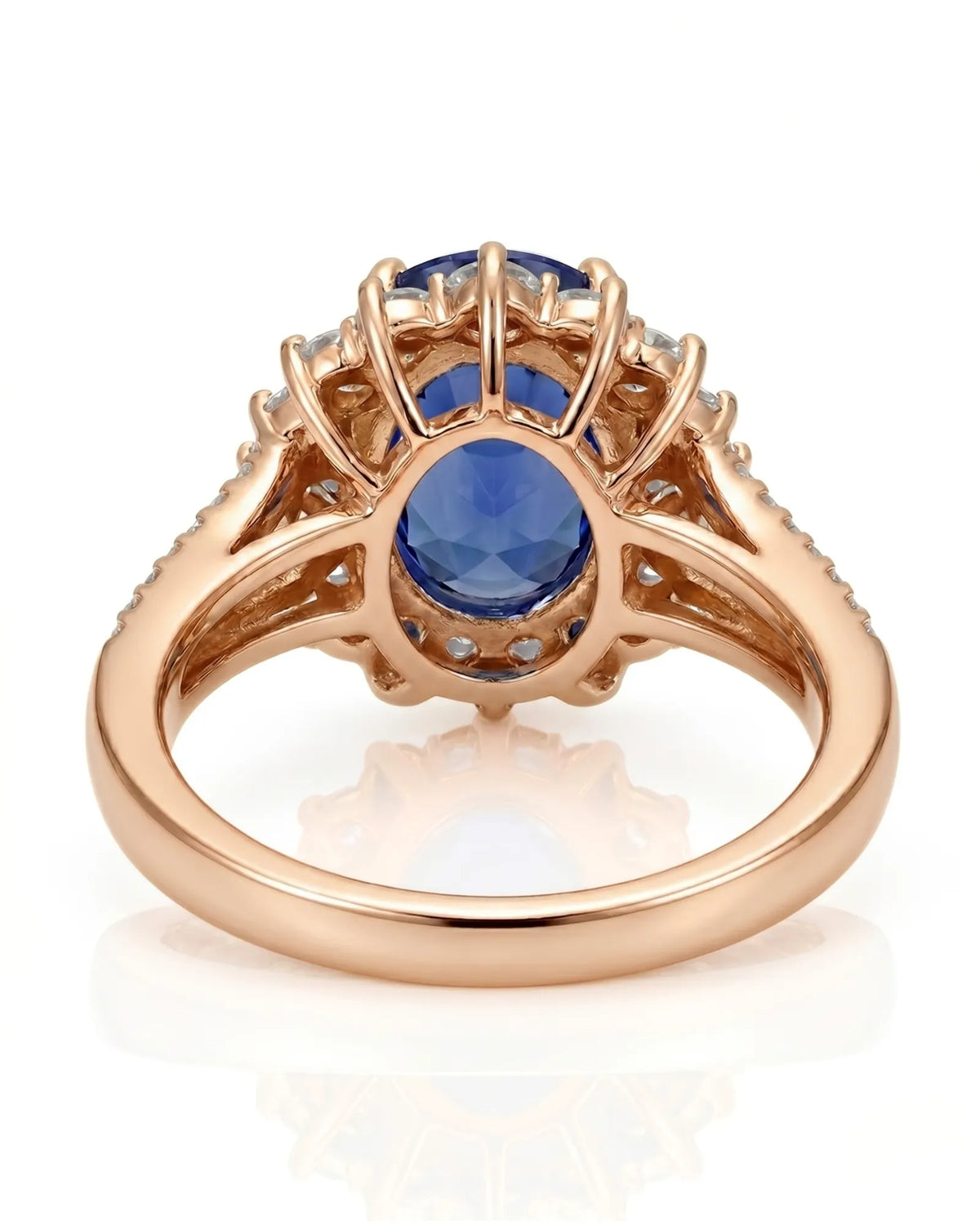 Royal blue oval sapphire ring with bright diamond halo in 18K rose gold | SARATTI