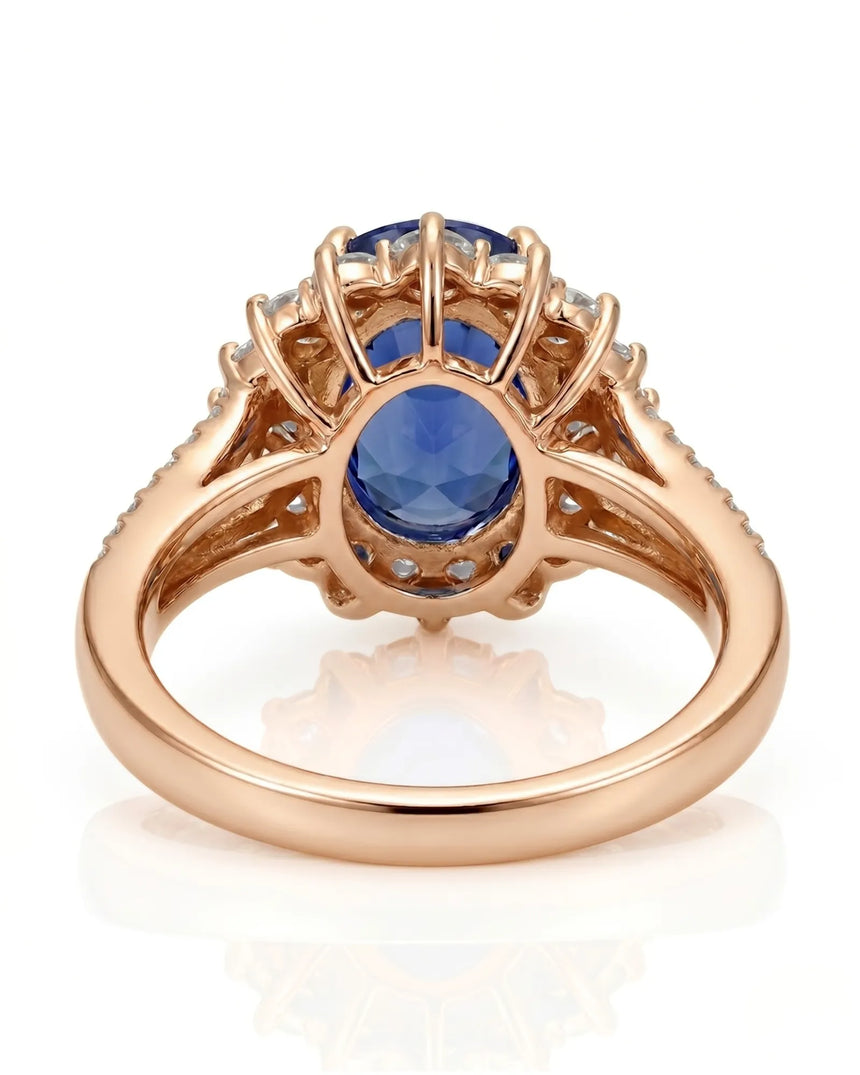 Royal blue oval sapphire ring with bright diamond halo in 18K rose gold | SARATTI