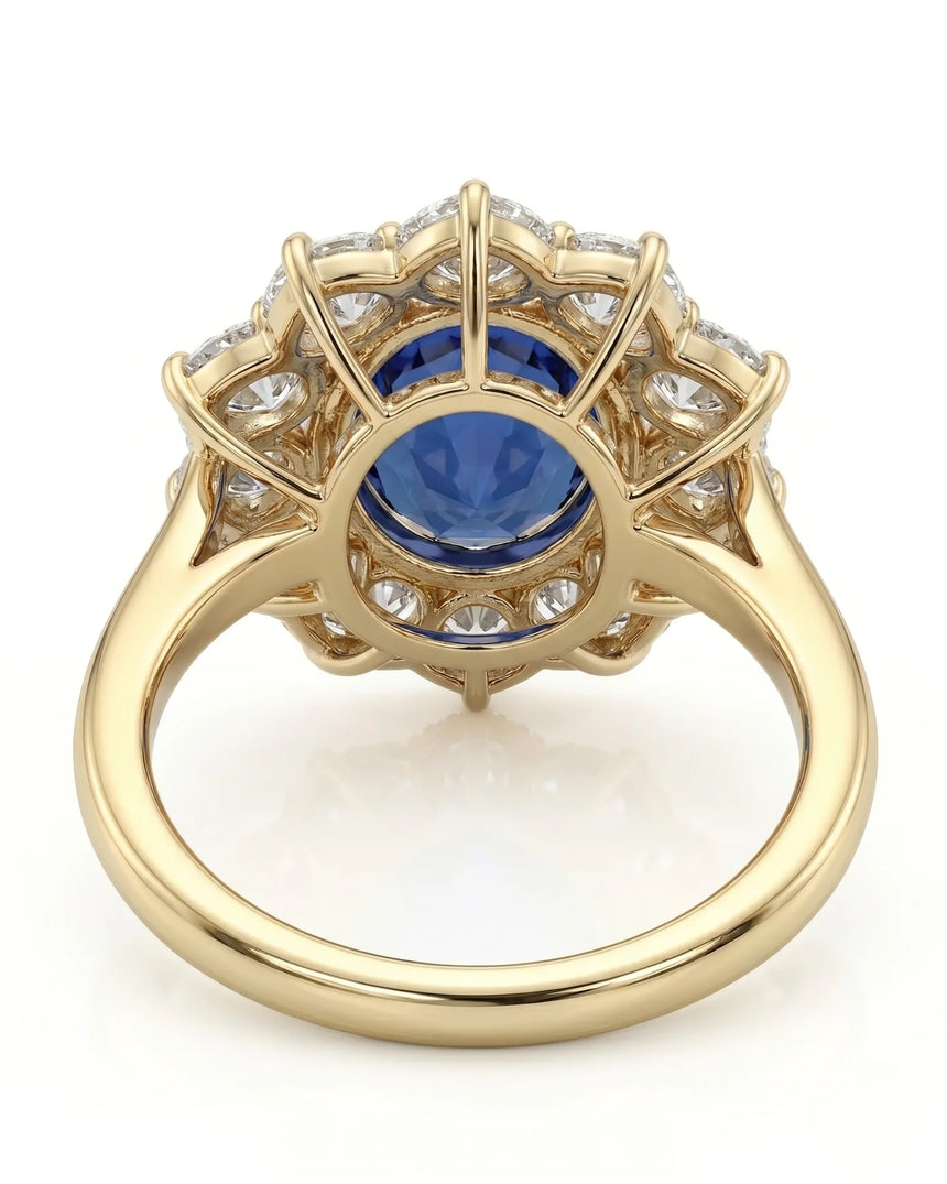 Royal blue oval sapphire ring with brilliant diamond halo in 18K yellow gold -- SARATTI