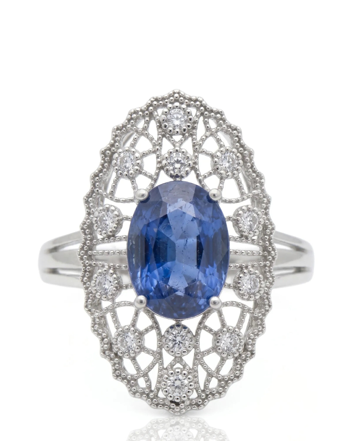 Royal blue oval sapphire ring with round brilliant diamonds in white gold | SARATTI