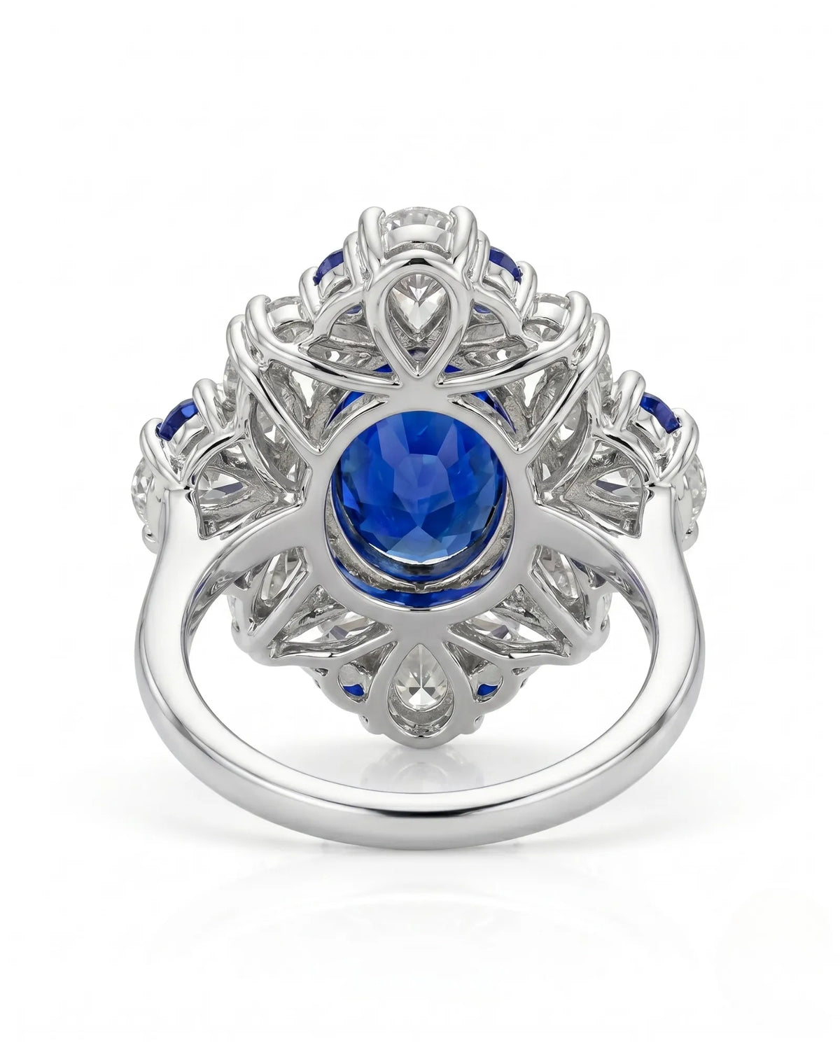 Royal sapphire ring with pear marquise and round diamond halo in platinum | SARATTI
