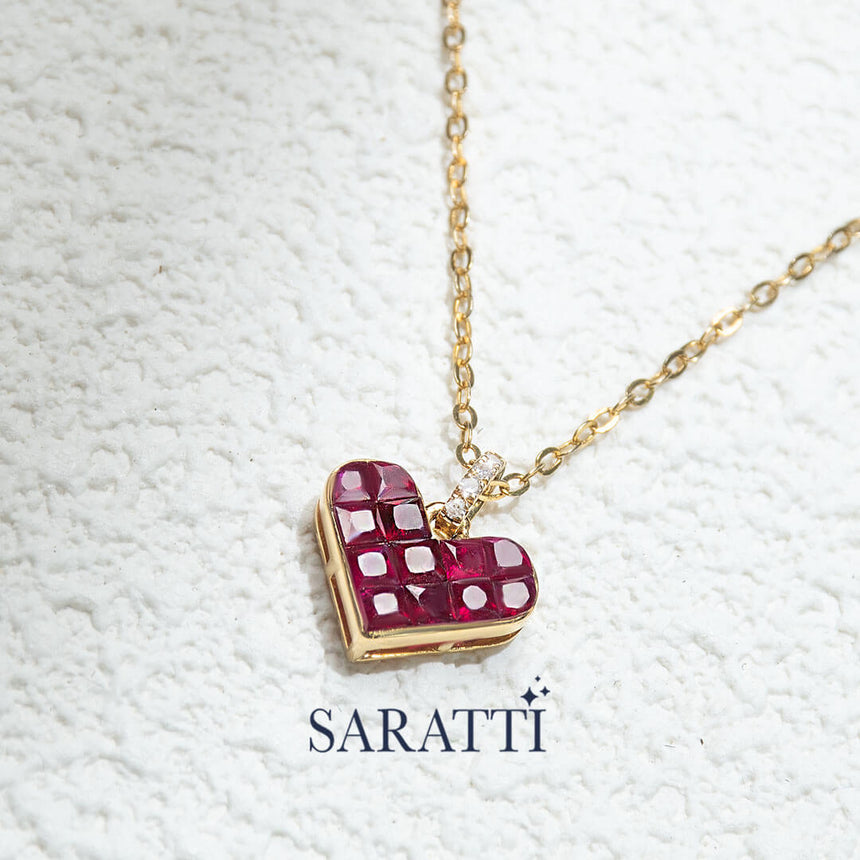 Close up shot of the Alma Rosa Ruby Heart Necklace | Saratti Fine Jewelry