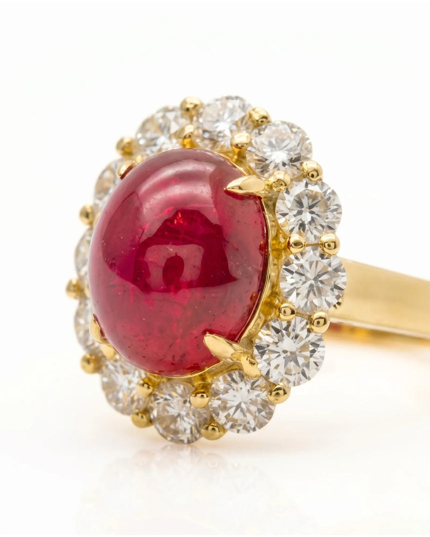 Ruby and diamond anniversary ring with oval center stone in 18K yellow gold | SARATTI