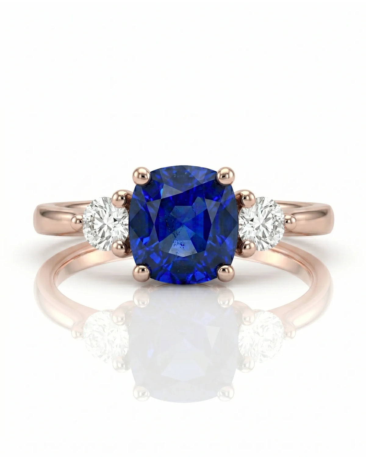 Sapphire and diamond engagement ring with classic three-stone design in rose gold | SARATTI